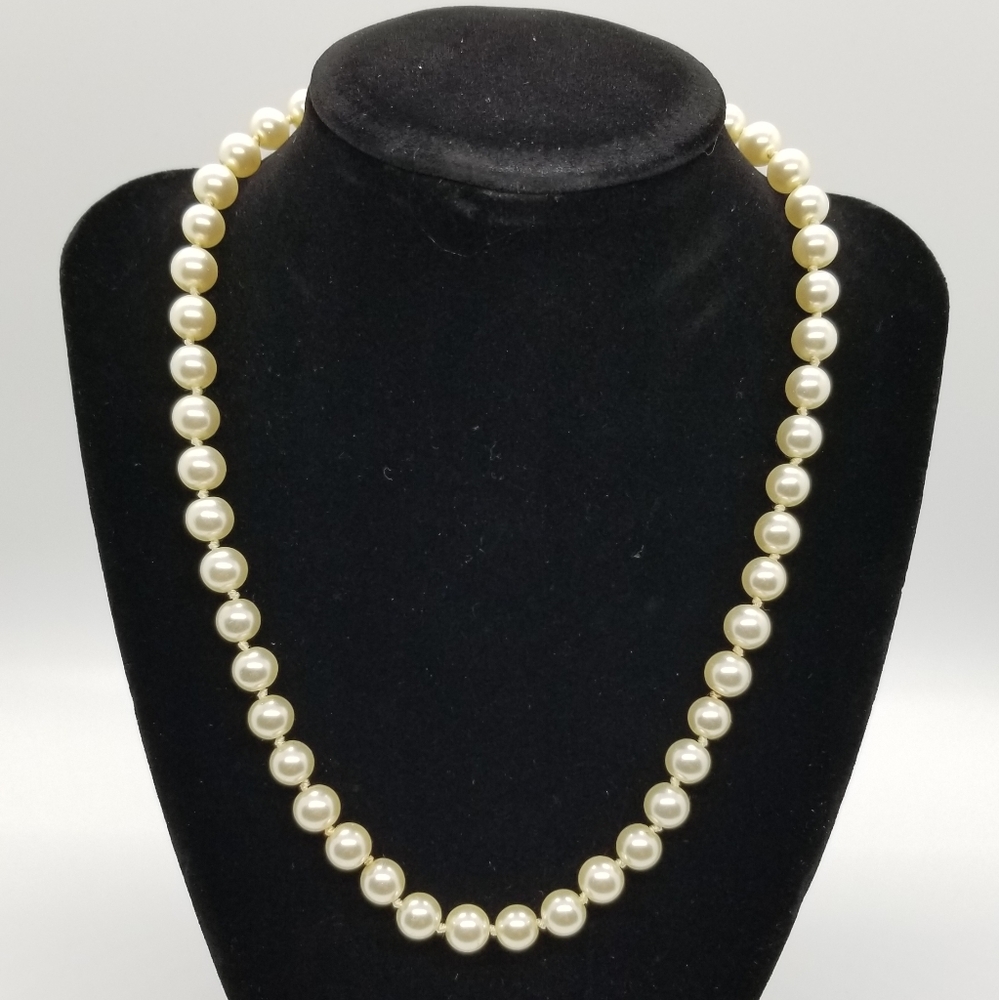White pearl necklace.